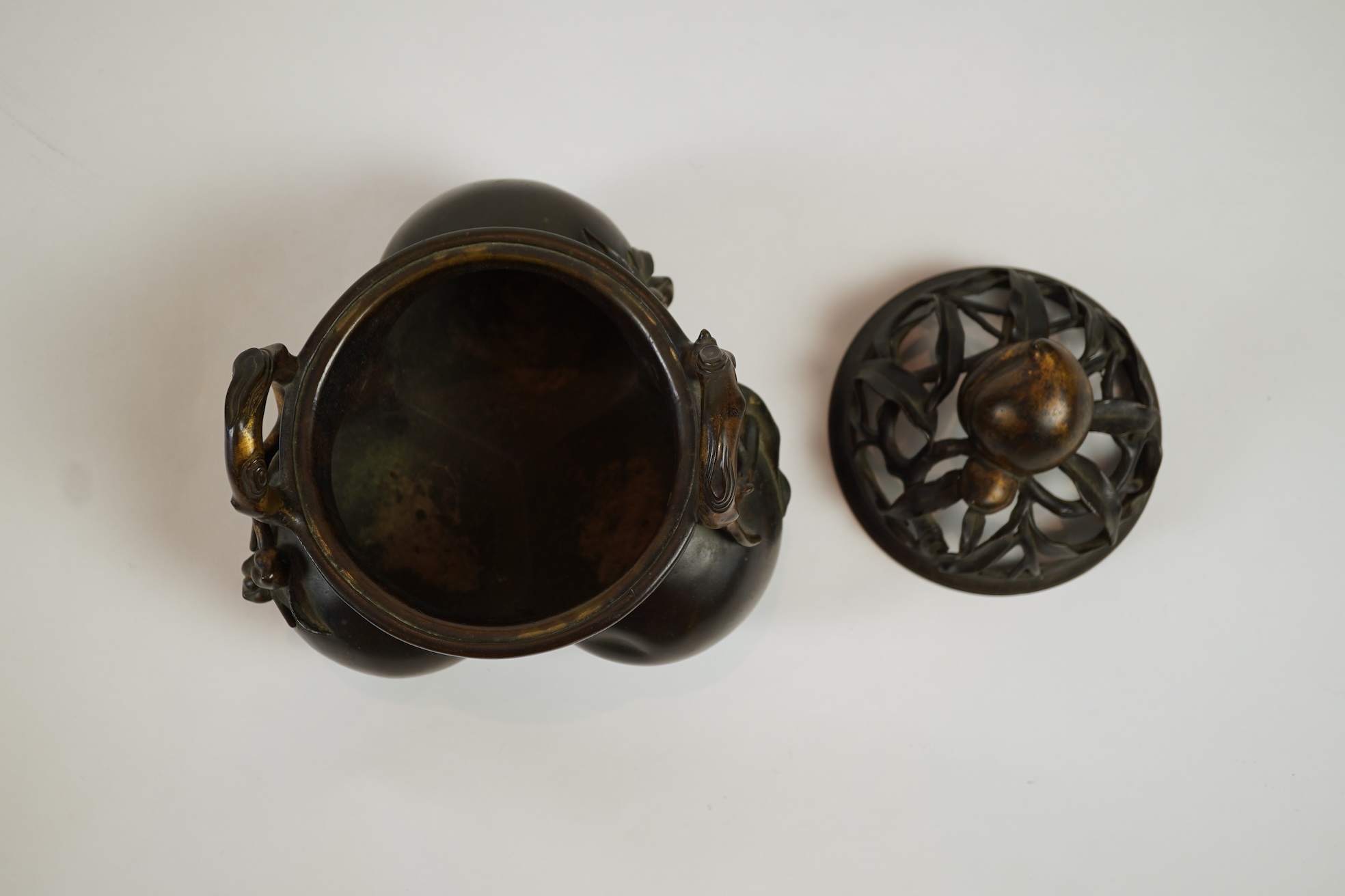 A large Chinese bronze and parcel gilt ‘peach’ censer and cover, Li, 17th/18th century